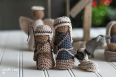 small crocheted toys are sitting on a table