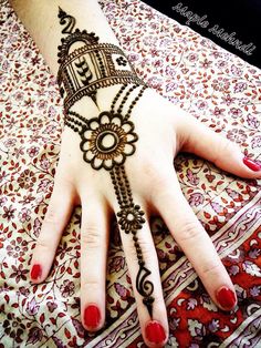 a woman's hand with henna on it and the words simple mehndi d