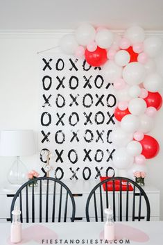 the balloon wall is decorated with pink, white and red balloons for a valentine's day party