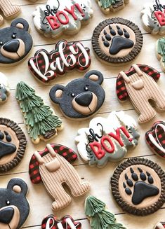 decorated cookies are arranged on a wooden table