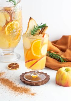 an apple cider with cinnamon and orange slices