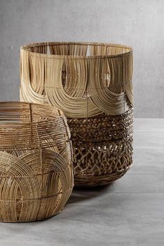 three woven baskets sitting next to each other