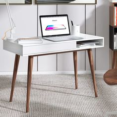 PRICES MAY VARY. ✅【Wide Desktop Area and Large Storage Space 】Overall dimensions are 42.5x19.7x29.5inch, large desktop allows you to put more items. The white writing desk with a cable grommet, making your desktop perfectly organized. The writing desk has hidden drawers with wave-shaped panels and handleless drawers, a stylish design, and a large storage space. ✅【Sturdy and Durable Mid Century Modern Desk】 Four solid wood legs of the writing desk structurally stable leg frame, reinforcing the wh Small Wood Desk, White Desk With Drawers, Modern Wood Desk, Simple Computer Desk, White Writing Desk, Wood Office Desk, Desk With Drawer, Small Office Desk, Mid Century Modern Desk