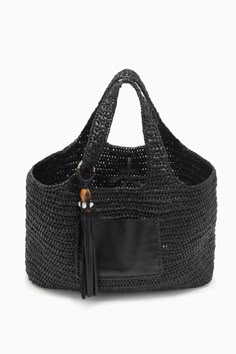 Our Kamari Tote is a refined, everyday bag made all the more elegant thanks to subtle detailing. Hand-woven from black raffia, it has a roomy interior that’s unlined to maintain its drapey silhouette and has two top handles you can easily slip over your shoulder. A whipstitched-trimmed leather pocket on the outside secures smaller items, while the leather tassel with antique brass ring adds an elevated touch. Composition: 100% Polypropene Pair with the Antilles Maillot to complete the look. Nyc Boutiques, Leather Pocket, Woven Tote Bag, Raffia Bag, Brass Ring, Signature Print, Handbag Shoes, Leather Tassel, Everyday Bag