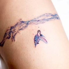 a woman with a tattoo on her thigh