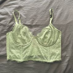 Never Worn As It Still Has A Tag On The Bra Strap Color Is More Light Mint Green As You Can See In Last Photo Size 36c Cute Going Out Top Just Need To Add Covers As It Is A Little See Through Also Have Another In Black!! Lace Tops With Underwire And Bra Friendly Design, Victoria's Secret Lace Camisole Top, Victoria's Secret Underwire Bra-friendly Tops, Victoria's Secret Green Bra For Spring, Victoria's Secret Lace Tops Bra Friendly, Victoria's Secret Fitted Lace Camisole, Fitted Lace Camisole By Victoria's Secret, Green Corset, Green Bras