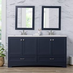 two mirrors are above the double sink vanity in this white and blue bathroom with wood flooring