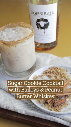 there is a drink and some cinnamon sticks on the table next to it, with text overlay that reads skewball sugar cookie cocktail