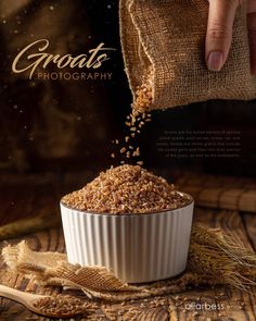 grain is being sprinkled into a white bowl