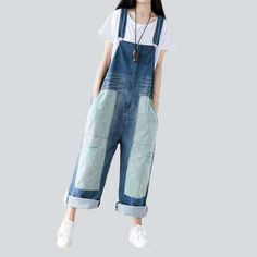 Introducing our 2023 Autumn Collection contrast color women's denim overalls ââ‚?a street style wardrobe staple that promises to make you the talk of the town!Why You'll Fall In LoveThis jumpsuit is the perfect amalgamation of modern fashion sensibilities and Y2K nostalgia. Crafted with love and care. it features a loose. baggy silhouette. intricate painted prints. and a sanded finish for a unique texture. Its vibrant color and delicate suspenders and buttons closure make for an eye-catching ens Casual Color Block Jeans For Spring, Trendy Contrast Color Cotton Jeans, Spring Casual Color Block Jeans, Casual Color Block Cotton Jeans, Blue Cotton Jeans With Contrast Color, Blue Baggy Straight Leg Overalls, Baggy Blue Straight Leg Overalls, Trendy Denim Jeans With Contrast Color, Trendy Denim Jeans With Contrast Color Details