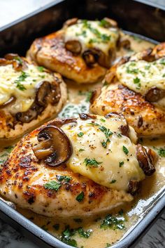 chicken with mushrooms and cheese in a pan