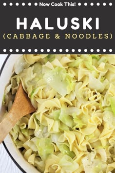 a bowl filled with cabbage and noodles next to a wooden spoon