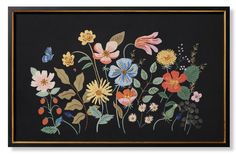 a painting with flowers and butterflies painted on the side of it in gold frame, black background