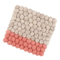 two colors of pebbles are arranged on top of each other in the shape of a rectangle