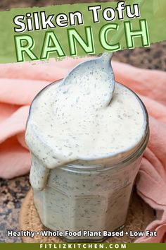 a spoon full of ranch dressing in a jar