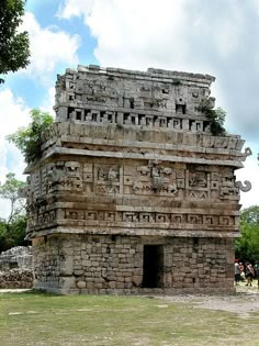 an old stone structure with carvings on it