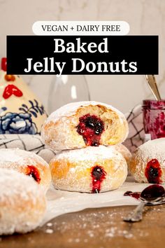 Many baked vegan jelly donuts are on a kitchen table with a jar of jelly and a ceramic chicken in the background. The donut on top has a bite taken out of it so you can see the fluffy inside. Text on the image reads, "vegan and dairy free baked jelly donuts". Sufganiyot Recipe, Simple Donuts, Cake Mix Doughnuts, Easy Gluten Free Banana Bread, Jelly Donuts Recipe, Easy Vegan Banana Bread, Donuts From Scratch, Baked Donut Holes, Savory Donuts