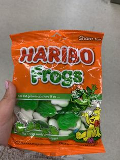 someone holding up a bag of harleo frogs