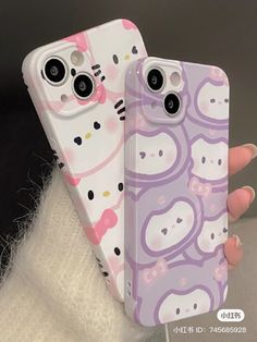 two hello kitty phone cases sitting next to each other