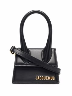 Black calf leather Le Chiquito mini tote bag from JACQUEMUS featuring gold-tone logo plaque, single top handle, foldover top with magnetic fastening, main compartment and adjustable detachable shoulder strap. | Jacquemus Le Chiquito mini tote bag Jacquemus Le Chiquito, Jacquemus Bag, Basket Sport, Black Leather Tote Bag, Mini Tote Bag, Dolce E Gabbana, Bag Trends, Mini Handbags, Mini Tote