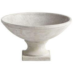 a white bowl sitting on top of a table