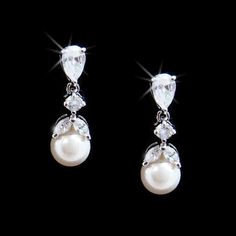 CZ%20and%20Pearl%20Bridal%20Earrings%0D%0AThese%20elegant%20wedding%20earrings%20feature%20lovely%20round%2C%20marquise%2C%20and%20pear%20cz%20cuts%20in%20rhodium%20silver%20plating%20with%20a%20lovely%20diamond%20white%20faux%20pearl%20drop.%20These%20dainty%20earrings%20are%20perfect%20for%20any%20wedding%20or%20special%20occasion.Size%3A%203%2F4%22%20long%20with%206mm%20Pearls.%0D%0AStyle%3A%20E3905.%0D%0AA%20beautiful%20accessory%20for%20the%20bride%20or%20her%20bridesmaids.%0D%0ANeed%20several%20pair%20of%20earrings%20for%20your%20wedding%20party%3F%20You%20can%20buy%20in%20bulk%20and%20save!%0D%0APlease%20allow%201%20week%20for%20delivery.%0D%0AShipping%20Policy.%0D%0AReturn%20Policy Marquise Diamond Earrings, Pearl Wedding Earrings, Pearl Drop Earrings Bridal, Pearl Bridal Earrings, Wedding Earrings Studs, Formal Earrings, Wedding Studs, Backdrops Necklace, Pearl Earrings Wedding