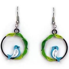 pair of earrings with green and blue bird on circular hoops, hanging from hooks