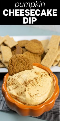 pumpkin cheesecake dip in an orange bowl with crackers