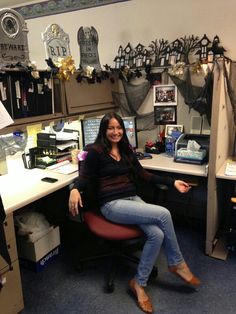 a woman is sitting in an office chair