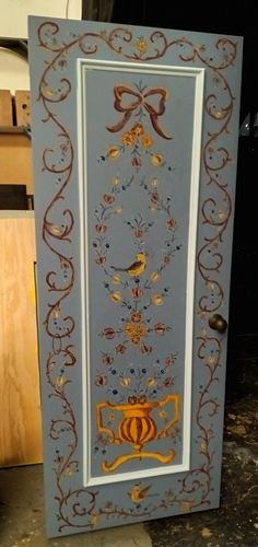 a blue and gold door with a bow on it