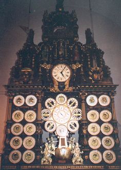 an ornate clock with many different clocks on it