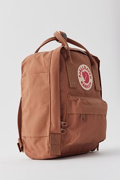 Fjällräven's classic Kånken backpack, now in a mini size perfect for festival days. Designed in 1978 and still just as relevant today with durable polyvinyl, a roomy main zip compartment and easily accessible front and side pockets. Complete with adjustable woven shoulder straps and dual top handles for easy carrying. Through their Arctic Fox Initiative, Fjallraven supports projects that help conserve nature including the threatened Arctic fox. Content + Care 100% Polyvinyl Spot clean Imported Size Length: 7.87" Width: 5.12" Height: 11.42" | Fjallraven Kånken Mini Backpack in Khaki, Women's at Urban Outfitters Kanken Classic, Baby Bats, Mini Mochila, Italy Trip, Closet Organizer, Arctic Fox