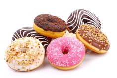 six donuts with different toppings on white background