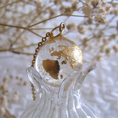 A beautiful handmade globe necklace made with jewelry grade resin and gold leaf! Gift idea for her. Earth planet pendant necklace celestial globe sphere necklace charm accessory jewelry #resin #handmade #jewelry #jewellery #celestial #earth #planet #gold #necklace #pendant #globe #feminine #elegant #gift #charm #ethereal Gold Necklace Pendant