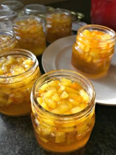 jars filled with food sitting on top of a table