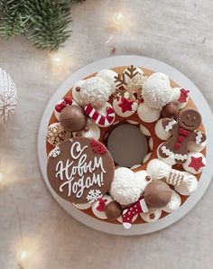 a decorated christmas cake sitting on top of a white plate