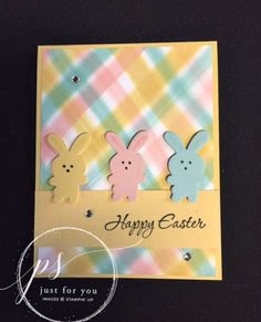 an easter card with three bunny cut outs on the front, and happy easter message in the back