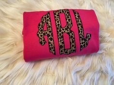 the monogrammed leopard print on this pink purse is perfect for any girl