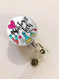 This ID Badge Reel is a perfect gift for a Radiology Tech. It features Phlebotomy drawings. This badge holder features a cute design with mylar overlay so you can clean the surface easily. The clear vinyl snap-on strap that holds the ID can be easily attached and removed. In the back, it has a metal belt clip that swivels for easy clipping on your scrubs or uniform. The strong nylon cord has 30 inches pull. Available in 2 sizes button: 1-1/4 inch and 1 3/4 inch. Choose the type of back clip you Phlebotomy Study, Radiology Tech, Personalized Pouch, Study Essentials, Tech Gift, Phlebotomy, Id Badge Reels, Carabiner Clip