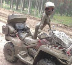 a man riding on the back of an atv