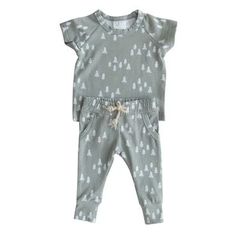 The Mebie Baby two-piece cozy pocket set for babies and toddlers up to 3t! These come with a short sleeve top and pocket + tie pants.  Color: Pines 95% Cotton, 5% Spandex Wash in cold water, Tumble dry low. Measurement in inches Length Width  0-3 Top Bottom    8.25 11.25   8 7.25 3-6 Top Bottom   9.25 13   8.5 7.5 6-12 Tie Pants, Boys Sleepwear, Spring Set, Short Sleeve Top