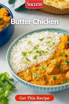 a blue bowl filled with rice and chicken curry next to another bowl full of food