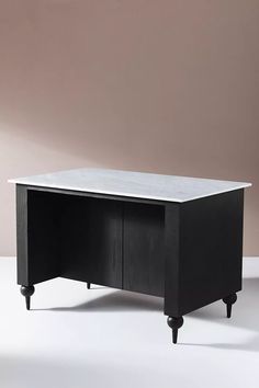 a black desk with two drawers on one side and an open drawer on the other