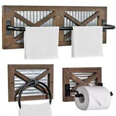 three pieces of wood with metal bars on them and two rolls of toilet paper hanging from the wall