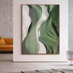 a painting hanging on the wall in a living room