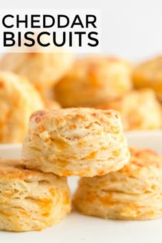 cheddar biscuits stacked on top of each other with the words cheddar biscuits above them