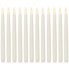 eight white candles lined up in a row on a white background with one candle lit and the other turned off