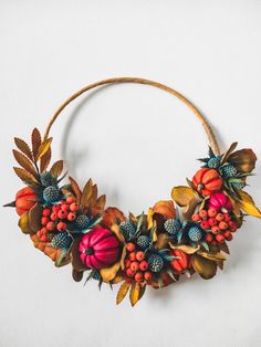 a wreath made out of leaves and berries