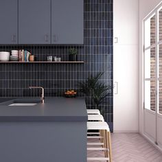 a modern kitchen with blue tile and wooden shelves on the wall next to an open window