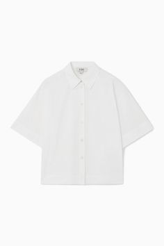 Swap out your long-sleeved shirts for this summery version as the weather warms. It's crafted from pure cotton-poplin that has a naturally breathable quality and designed in a slightly boxy shape that'll work just as well tucked in as it will left loose over skirts and pants.- Regular fit- Button closure- Short sleeves100% Cotton / Machine washBack length of size  6 is 22.04" / Model wears a size 6 Modern Tops, Women Magazines, Poplin Shirt, Cotton Poplin, White Tops, Sleeve Cotton, Cotton Shorts, Cotton Shirt, Pure Cotton